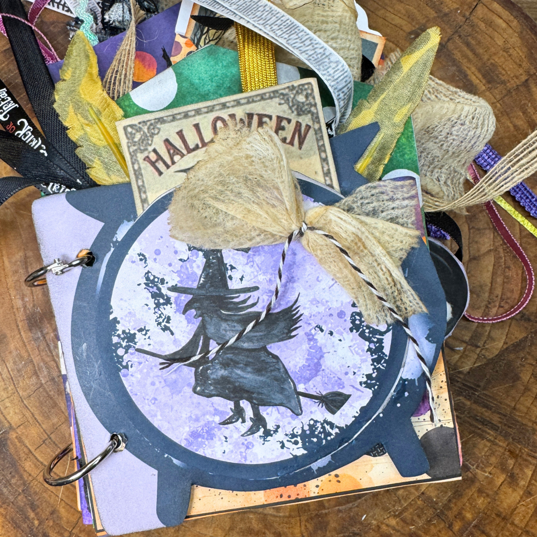 Halloween-themed memory keeper with a witch design.
