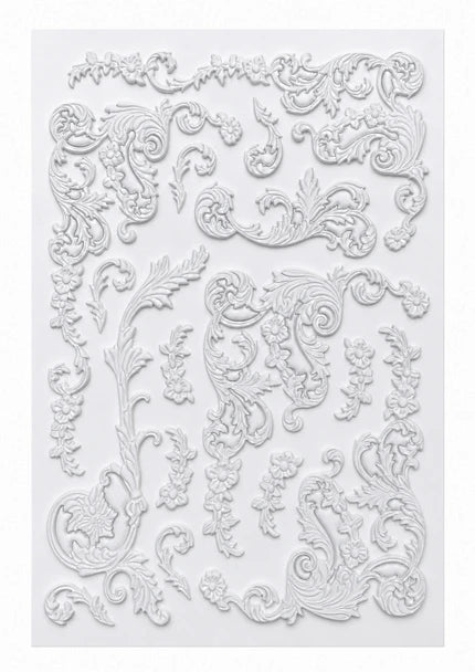 White embossed decorative panel featuring intricate baroque-style scrollwork, floral motifs, and ornate relief patterns on a light gray background.